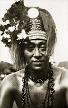 Samoan chief in 'meke' dress. Portrait of a Samoan chief wearing traditional 'meke' dress. His long