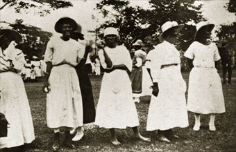 Jamaican ladies. Portrait of a group of Jamaican women dressed in white wearing European-style