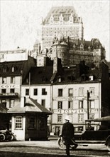 Old town, Quebec. View of shopfronts in the old town with the Chateau Frontenac Hotel visible in
