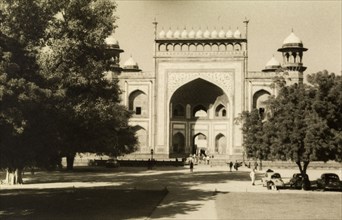 Gateway to the Taj Mahal. Tourists pass through the Darwaza, the decorative gateway built from red