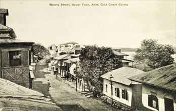 View of Axim, Gold Coast. Postcard view of Murphy Street in the upper town. Axim, Gold Coast