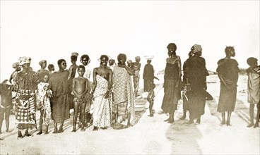 Gold Coast women and children. A group of West African women and children wearing traditional dress