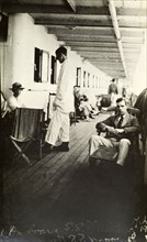 Tamlin en route to Africa. Mr Alfred Tamlin relaxes on the deck of an unidentified passenger ship