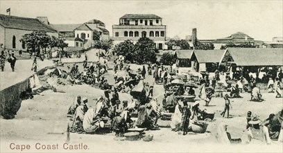 Cape Coast castle. Scene showing a busy local market taking place inside a castle. Cape Coast, Gold