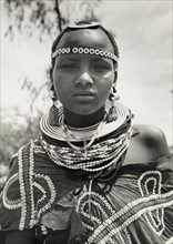 Young Maasai woman. Close-up portrait of a young Maasai woman wearing traditional jewellery