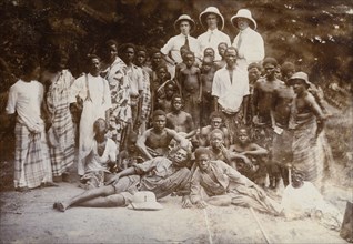 Group photograph, Western Africa. Mr Alfred Tamlin (the European on the left) poses for the camera