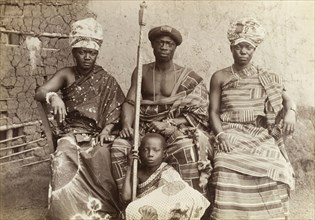 The Mensa of Kumasi and his family. Outdoors portrait of the Mensa of Kumasi with his two wives and
