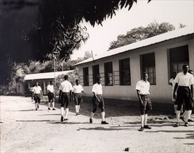 Tanganyikan students outside college. Official publicity shot for the Tanganyikan government. Young