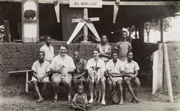 Workshop employees. Two British colonial officers identified as Charles Simpson (left) and Cyril