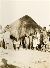 African workers and children at Balloch Farm. Portrait of a group of male African farm workers and