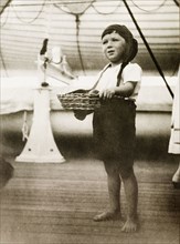 Boy in fancy dress aboard RMS Arundel Castle. Portrait of a young boy dressed in costume for a