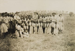 Kenyan scouts and guides. A group of uniformed Kenyan scouts and guides pose for the camera