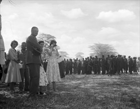 Princess Margaret watches a Maasai dance. Princess Margaret and her entourage watch from the