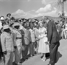Princess Margaret meets ex-servicemen. A crowd of onlookers watch as Princess Margaret is