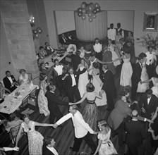 Dancing the 'Eightsome Reel'. European party guests fill the dancefloor to dance the 'Eightsome