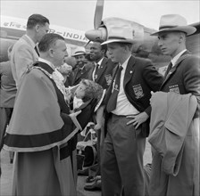 The Kenyan Olympic team depart. A local Mayor bids farewell to the 1956 Kenyan Olympic team as they