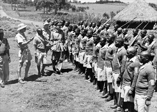 Inspecting the Home Guard at Kangare. An official photograph of Colonel Morcombe, director of the