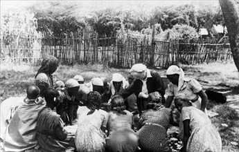 Nellie Grant teaches Kikuyu women. Nellie Grant, the wife of settler farmer Jos Grant and mother of