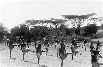 Kikuyu children exercising. Children perform coordinated exercises in a secure village established