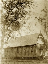 A temporary church in Indooroopilly. A makeshift wooden building with a pitched roof serves as a