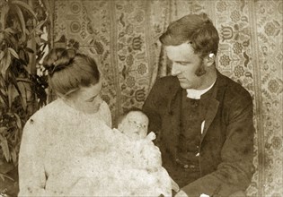 Mr and Mrs Pughe with their baby. Ellen May Pughe and her husband Reverend Thomas St John Parry