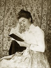 Portrait of a Victorian lady, Australia. Portrait of a Victorian lady reading from a book against a