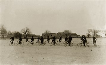 Musical bicycle ride. Identified as 'The 1st Buffs' bicycle section', a group of British cyclists