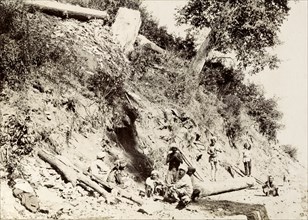 Wood cutters in the Himalayas. A group of wood cutters take a rest from their labours on a hillside