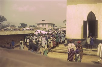 Bishop Osanyin's funeral. Crowds gather outside a church for the funeral of Bishop Osanyin.