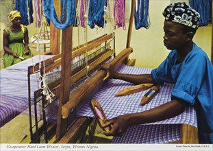 Hand loom weaver, Nigeria. A colourful tourist postcard depicts a hand loom weaver at work in a