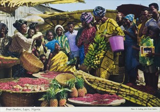 Fruit traders, Nigeria. A colourful tourist postcard depicts a busy outdoors market scene with