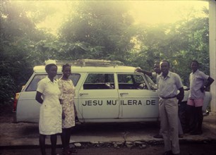 Mobile clinic, Nigeria. Workers at a Church of Nigeria hospital pose for the camera beside an