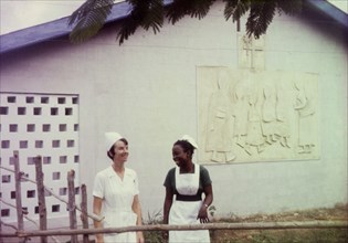 Nurses at a Church of Nigeria hospital. A European nurse and an African midwife share a joke