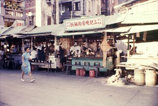 Chow stalls on a city street. Chow stalls vie for trade, selling fast food to passing customers on