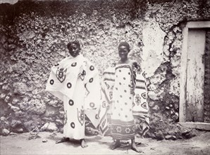 Zanzibar women. Portrait of two Zanzibar women dressed in patterned wrap-around robes. Zanzibar