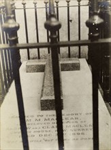 Tombstone of Sir Harry McLean's sister. View through railings of the Christian tombstone of General