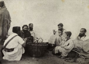 Jewish egg merchants. A group of Jewish egg merchants chat in a group around baskets containing