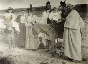 The Russi children on a donkey ride. A European governess and two Moroccan servants accompany Mrs