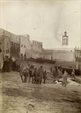 Harbourside market place, Safi. Morrocan people mill about at a market place near the harbour in