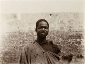 Labourer in Safi, Morocco. Outdoors portrait of a sub-Saharan African man in ragged clothing. A