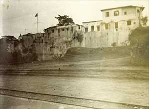The fort'. A building with high walls near a small railway track is identified only as 'the fort'.