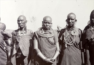 Maasai women. Portrait of three Maasai women wearing traditional dress, their heads shaved and
