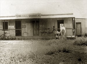 Town Hall Chambers, Nairobi. Bicycles and a horse stand outside the The Town Hall Chambers in