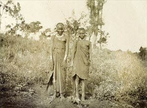 Two Kikuyu women. Two young Kikuyu women wearing traditional dress and masses of hooped earrings,