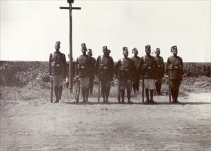 Askari escort on safari. A group of uniformed askaris (soldiers) provide an escort for Frederick