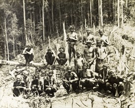 North Malaysian aborigines. Portrait of a group of Malaysian aborigines sitting amongst the forest