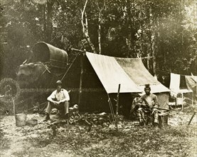 British survey camp. Trigonometrical survey camp of a British surveyor and his Malayan assistant.