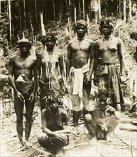 Aboriginal people of northern Malaysia. A group of semi-naked aborigines from the forests of