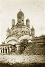 The Dakshineshwar Temple. The Dakshineshwar temple at Kali Ghat, adorned with nine 'chhatris'