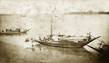 Fishing boats near Chandernagore. A small fishing boat, manned by a crew of four, waits for the off